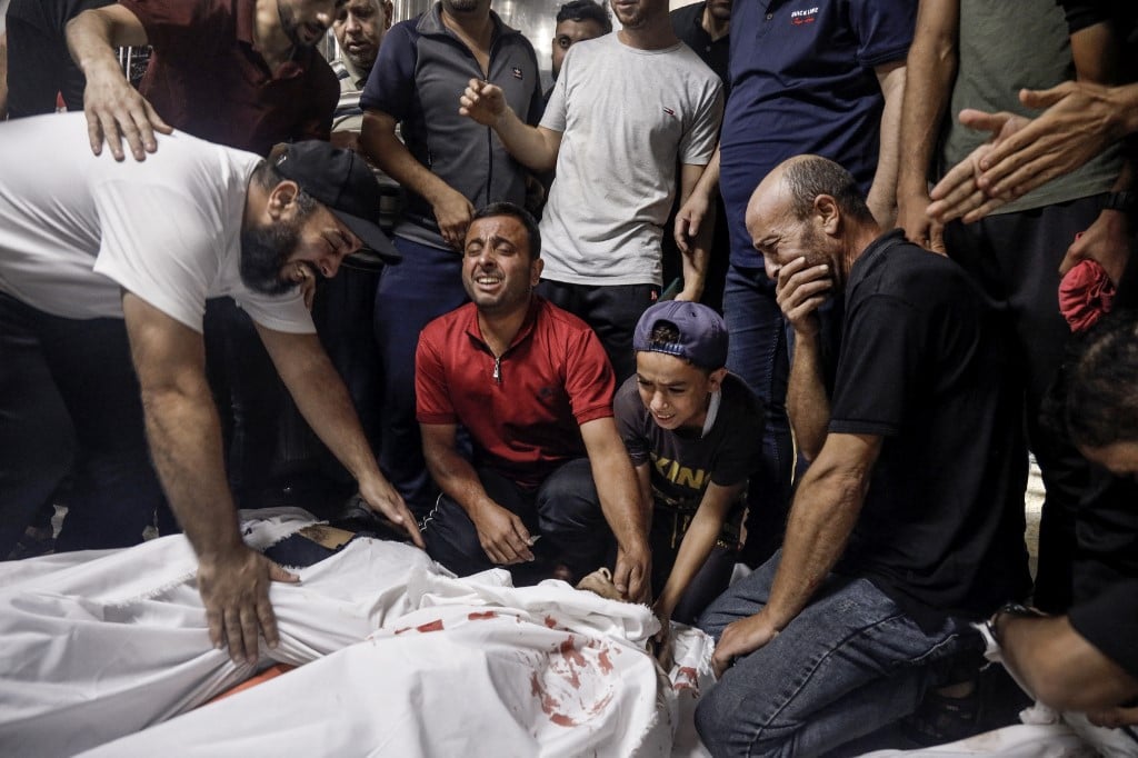 Mass graves, ice-cream truck mortuary as bodies pile up in Gaza