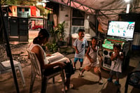 ‘We love singing’: Filipinos find joy in karaoke
