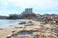 View of damages in the beach area following the passage of Hurricane Otis in Acapulco, Guerrero State, Mexico, on October 26, 2023. Hurricane Otis killed at least 27 people as it lashed Mexico's beach resort city of Acapulco as a scale-topping category 5 storm, officials said Thursday, in what residents called a "total disaster.". Hurricane Otis killed at least 27 people as it lashed Mexico's beach resort city of Acapulco as a scale-topping category 5 storm, officials said Thursday, in what residents called a "total disaster." (Photo by FRANCISCO ROBLES / AFP)