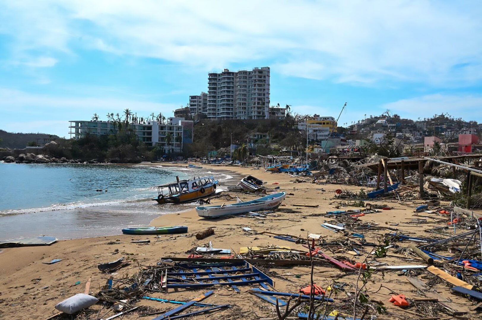View of damages in the beach area following the passage of Hurricane Otis in Acapulco, Guerrero State, Mexico, on October 26, 2023. Hurricane Otis killed at least 27 people as it lashed Mexico's beach resort city of Acapulco as a scale-topping category 5 storm, officials said Thursday, in what residents called a "total disaster.". Hurricane Otis killed at least 27 people as it lashed Mexico's beach resort city of Acapulco as a scale-topping category 5 storm, officials said Thursday, in what residents called a "total disaster." (Photo by FRANCISCO ROBLES / AFP)