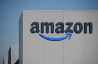 FILE PHOTO: The US giant Amazon logo is pictured on the opening day of a new distribution center in Augny on 23 September 2021. (Photo by SEBASTIEN BOZON / AFP)