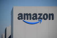 FILE PHOTO: The US giant Amazon logo is pictured on the opening day of a new distribution center in Augny on 23 September 2021. (Photo by SEBASTIEN BOZON / AFP)