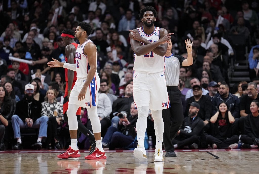 Joel Embiid connives with Tyrese Maxey in powering the Philadelphia 76ers to a come-from-behind 114-107 victory over the Toronto Raptors. Photo by MARK BLINCH / GETTY IMAGES NORTH AMERICA / Getty Images via AFP