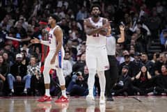 Joel Embiid connives with Tyrese Maxey in powering the Philadelphia 76ers to a come-from-behind 114-107 victory over the Toronto Raptors. Photo by MARK BLINCH / GETTY IMAGES NORTH AMERICA / Getty Images via AFP