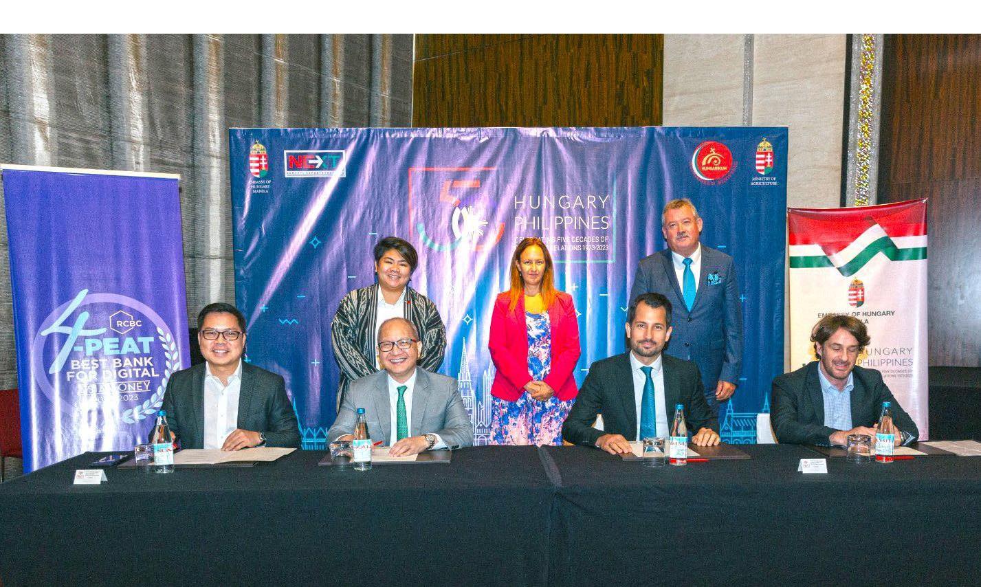 Standing from left: Department of Migrant Workers Undersecretary for Policy and International Cooperation Atty. Patricia Yvonne Caunan, Deputy State Secretary for External Economic Relations of the Ministry of Foreign Affairs and Trade of Hungary Katalin Bihari, and Prime Minister’s Commissioner for the protection of the Hungarian way of life and national values Zsolt V. Németh. Seated from left: RCBC Executive Vice President and Chief Innovation and Inclusion Officer Lito Villanueva, RCBC President and CEO Eugene Acevedo, Founder and CEO of Peak Card Services Ltd. Márton Suppan, and Columbus Private Equity Fund Board Member Gábor Rudas.