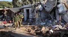 Israeli officer says he found beheaded baby in attacked kibbutz