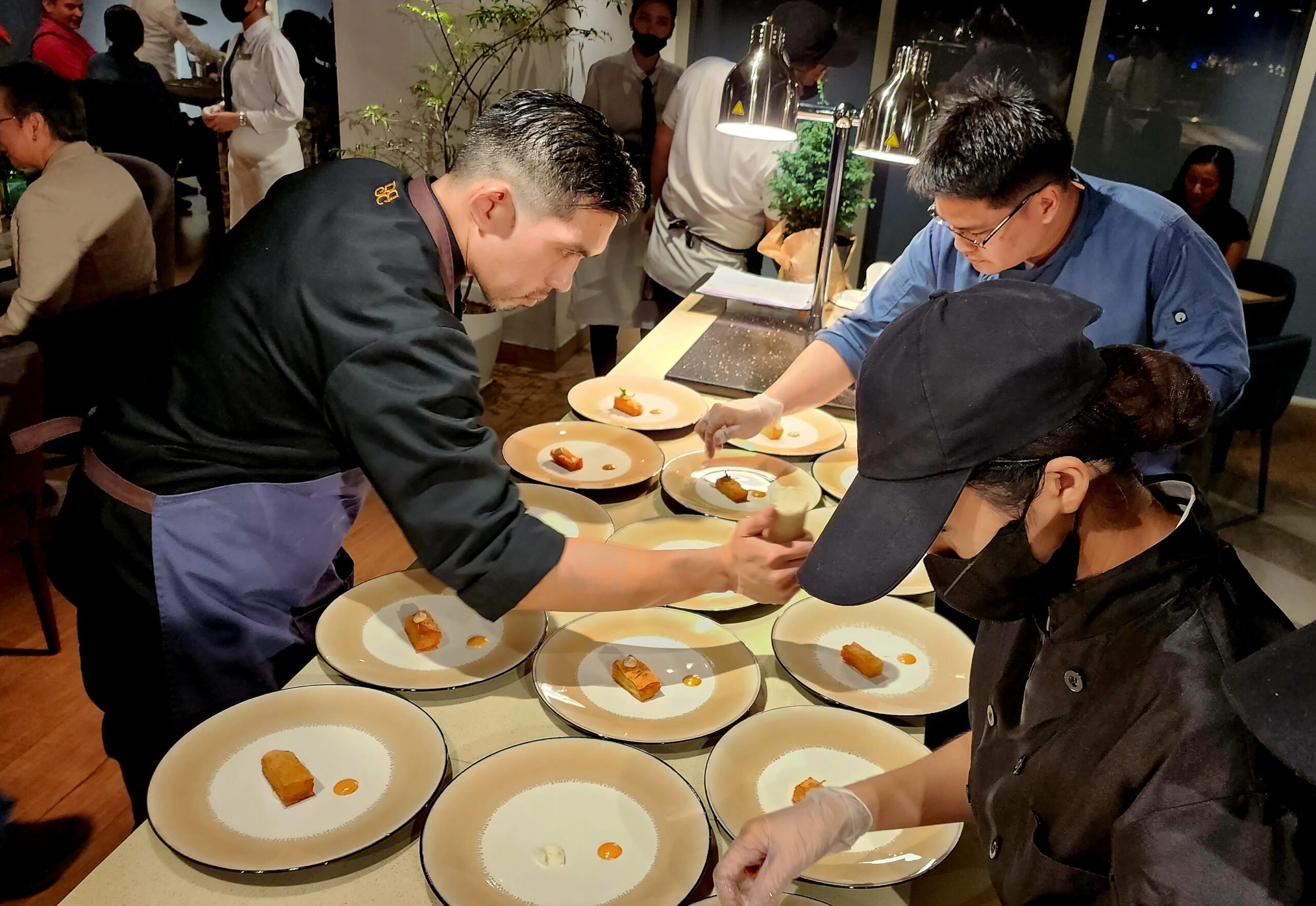 Chef Francis David busy preparing a dish.(Photographs  by Roel Hoang Manipon for the Daily Tribune)
