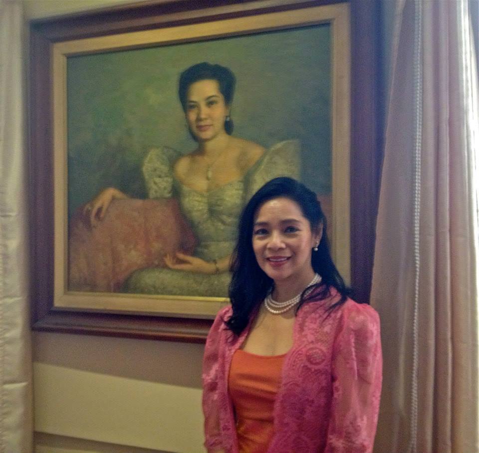 MAV Rufino with the painting of her mother Julie Abad Rufino in the background.