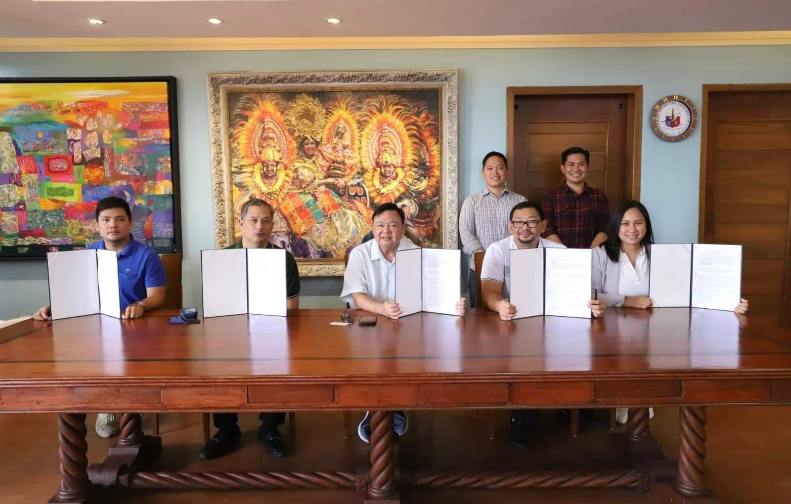 At the MOU signing: PHINMA Properties represented by president and CEO Raphael Felix (second from left), chief business development officer Engr. Francis Villegas (second from right), business development director Joni Lopez-David (rightmost), business development officer Gabriel Tanada (standing left), partners with the Local Government of Iloilo, led by Mayor Jerry Treñas (middle), Iloilo City Councilor Miguel Treñas (leftmost), and Legal Counsel Atty. Peter Millare (standing right), with a shared purpose of advancing affordable housing initiatives for Filipinos’ better quality of life. | photograph courtesy of PHINMA