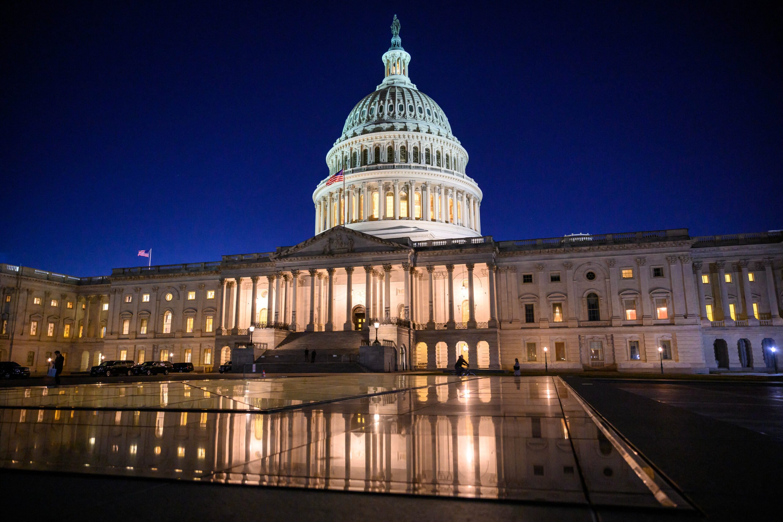 The US Capitol is seen at dusk in this 9 January photo. The US Congress passed an 11th-hour funding bill on Saturday to keep federal agencies running for another 45 days and avert a costly government shutdown — although the deal left out aid to war-torn Ukraine requested by President Joe Biden. | Mandel NGAN/AGENCE FRANCE-PRESSE