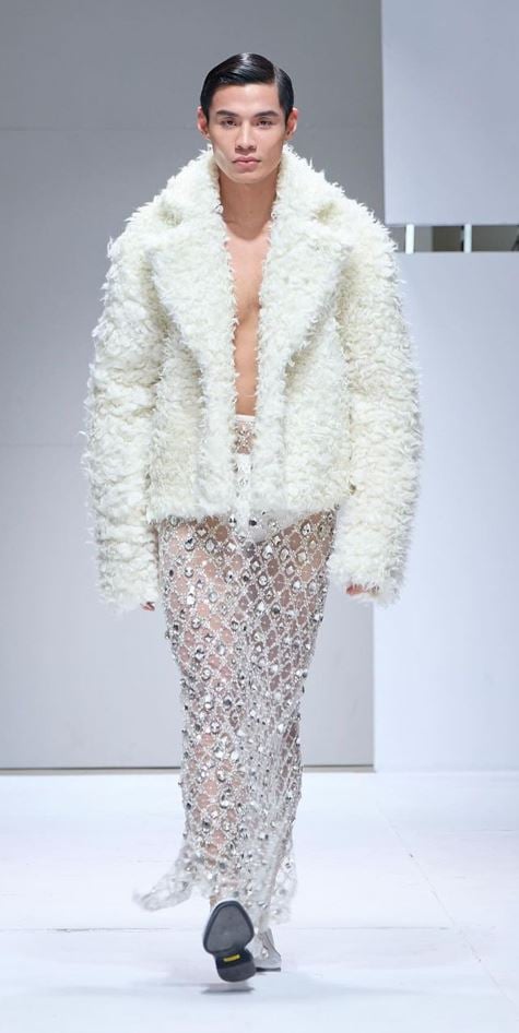 BELTRAN's white ensemble with a combination of lace, silk, chiffon and taffeta, adorned with hand-crafted flowers.