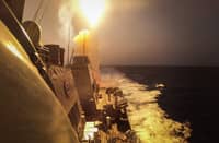 FILE PHOTO: This handout picture courtesy of the US Navy taken on 19 October 2023 shows the Arleigh Burke-class guided-missile destroyer USS Carney (DDG 64) defeating a combination of Houthi missiles and unmanned aerial vehicles in the Red Sea. (Photo by Aaron Lau / US NAVY / AFP)