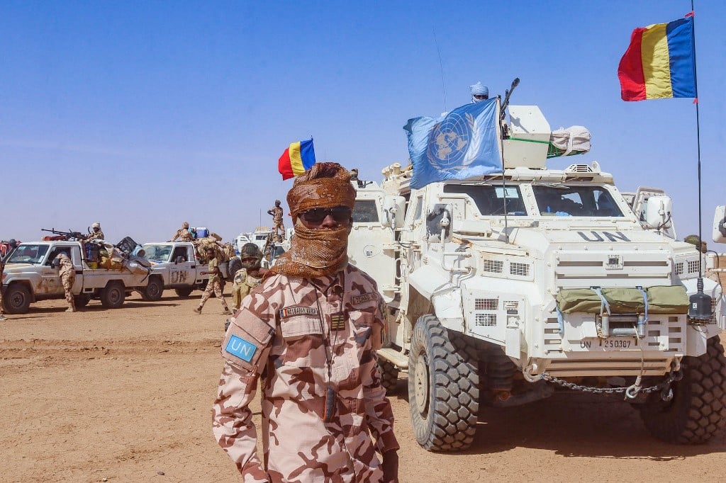 FILE PHOTO: This handout photo taken by MINUSMA on 25 October 2023 shows a Chadian soldier with the United Nations Multidimensional Integrated Stabilization Mission in Mali (MINUSMA) standing in front of a convoy outside the city of Gao, after withdrawing from their bases in Tessalit and Aguelok in the North of Mali. (Photo by MINUSMA / AFP)