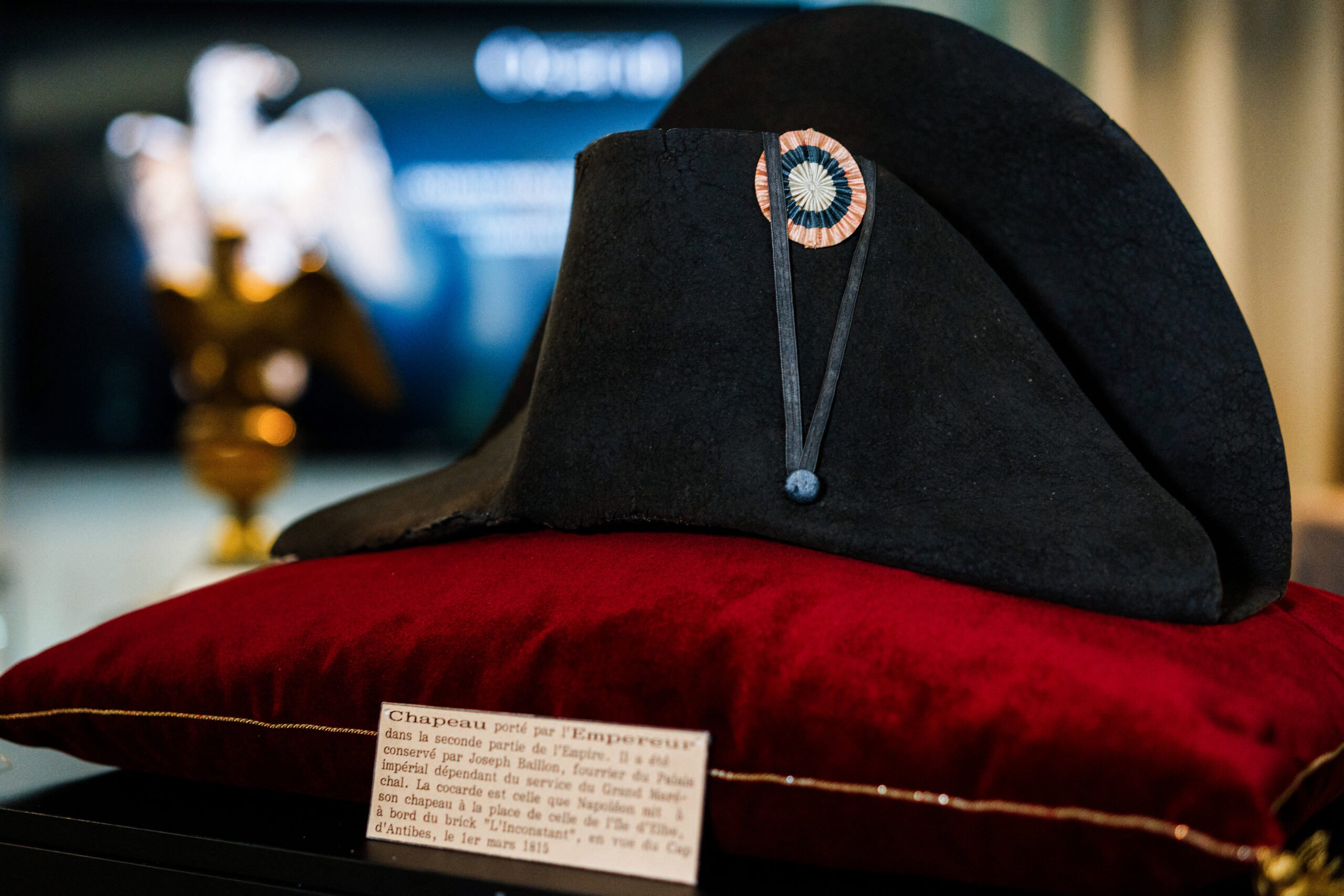 A black bicorne hat with red, white and blue cockade worn by the French Emperor Napoleon I (1769-1821), from the Collection Jean Louis Noisiez, is displayed before an auction sale at Osenat auction house in Paris on 6 November 2023. (Photo by Dimitar DILKOFF / AFP)