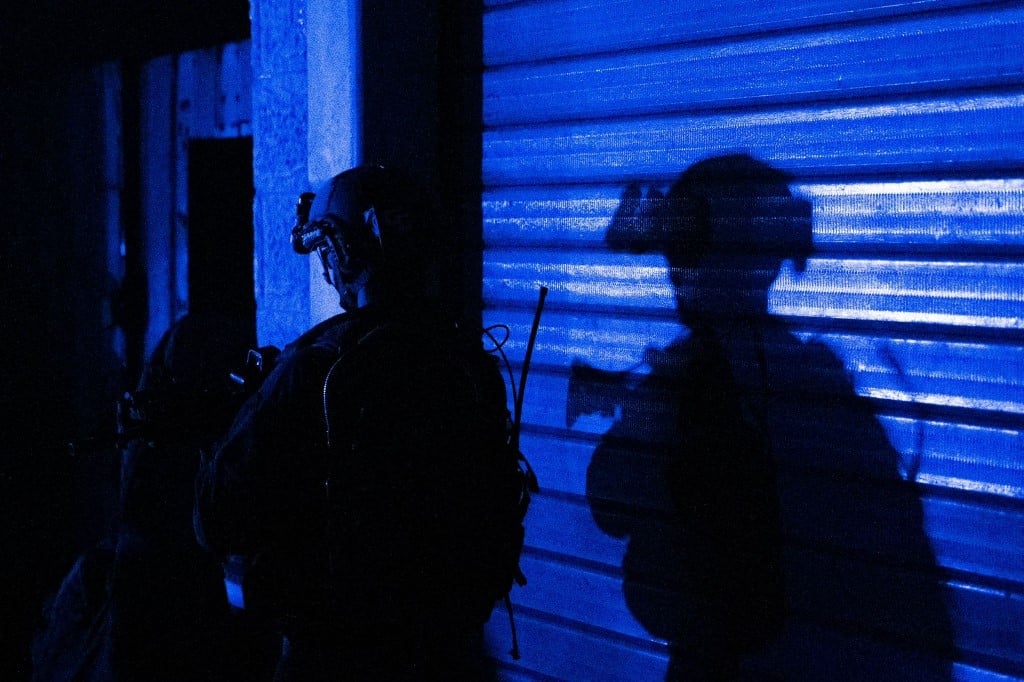 ‘Raise your hands’: Israel raids hospital in center of Gaza war