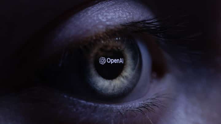 FILE PHOTO: This illustration photograph taken with a macro lens shows an 'OpenAI' logo reverse projected onto a human eye at a studio in Paris. (Photo by JOEL SAGET / AFP)