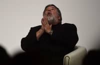 FILE PHOTO: US Apple co-founder and engineer Steve Wozniak gestures during a chat as part of the South Summit in Madrid on 7 October 2015. (Photo by PIERRE-PHILIPPE MARCOU / AFP)