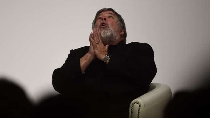 FILE PHOTO: US Apple co-founder and engineer Steve Wozniak gestures during a chat as part of the South Summit in Madrid on 7 October 2015. (Photo by PIERRE-PHILIPPE MARCOU / AFP)