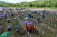 FILE PHOTO: Residents and survivors visit the mass graves for victims during a memorial ceremony marking the first anniversary of Super Typhoon Haiyan, known locally as Yolanda, at a mass grave in the village of Vasper, Tacloban City, central Philippines on 8 November 2014. (Photo by TED ALJIBE / AFP)