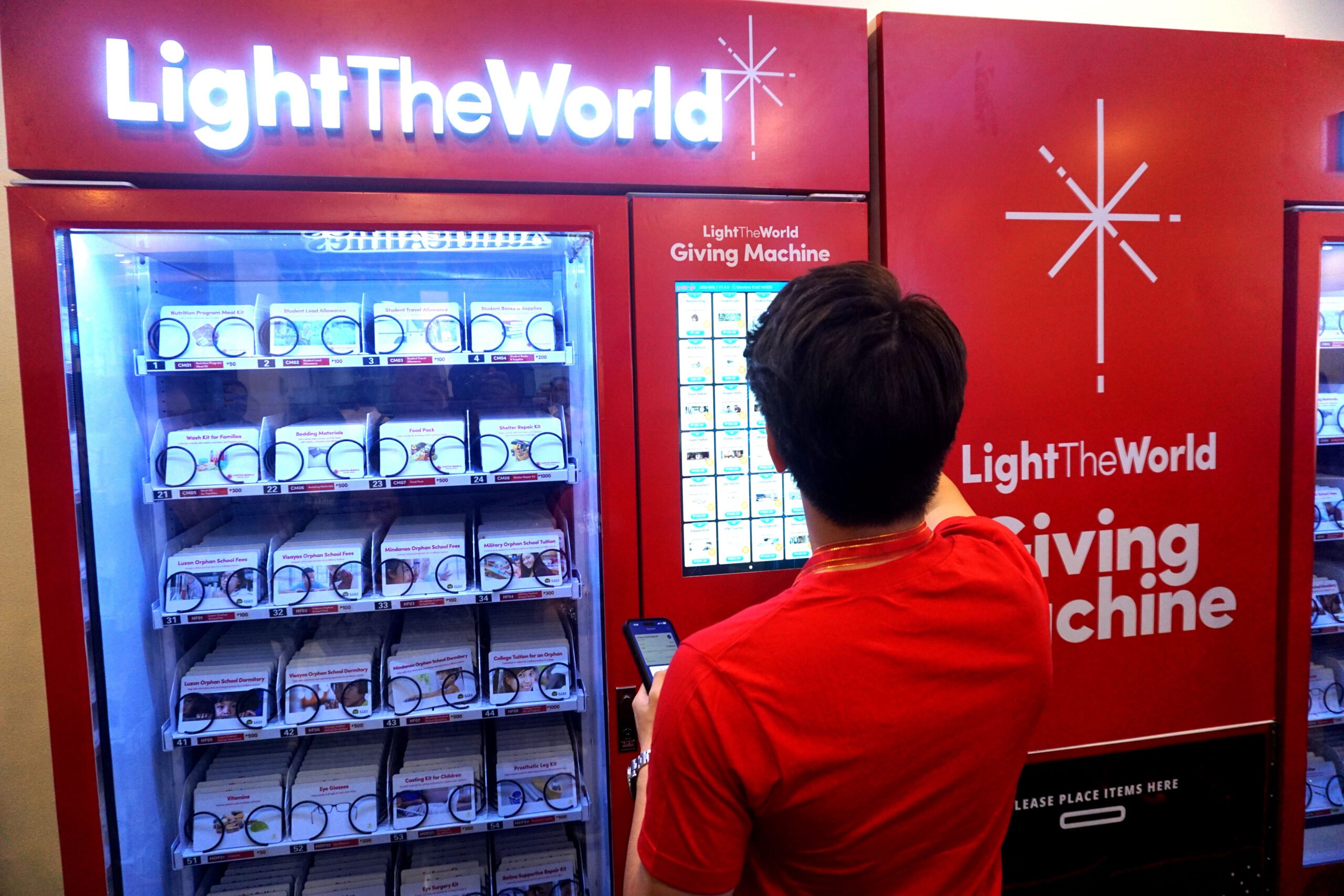 some product cards inside the Manila Giving Machines contain unique Tabernacle Choir stickers. | PHOTOGRAPHS COURTESY OF LIGHT THE WORLD 
GIVING MACHINES