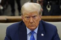 FILE PHOTO: Former US president Donald Trump sits in the courtroom during his civil fraud trial at New York State Supreme Court on 6 November 2023 in New York City. (Photo by POOL / GETTY IMAGES NORTH AMERICA / Getty Images via AFP)