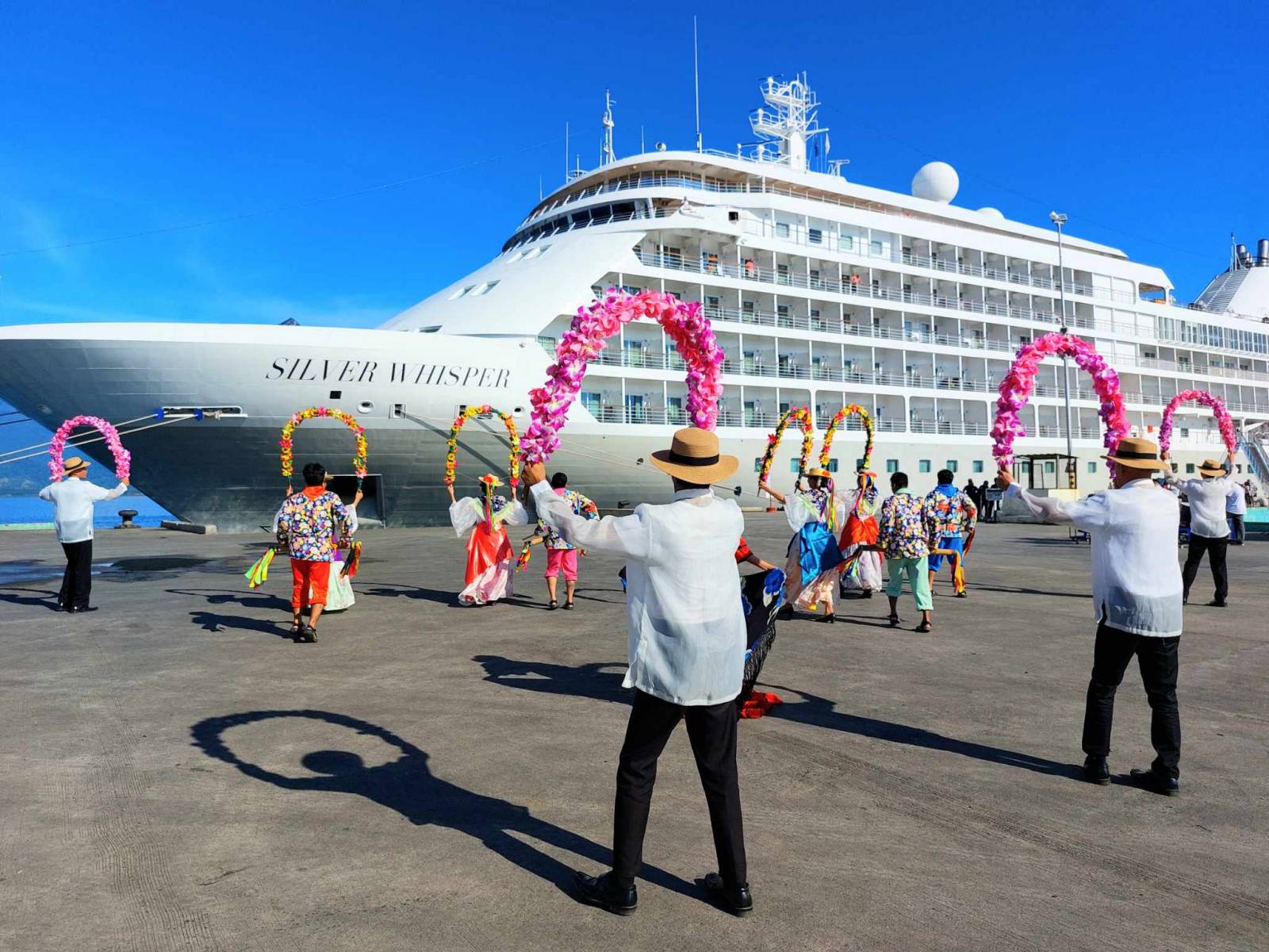 Puerto Princesa tourism performers welcome the arrival of MS Silver Whisper, one of six cruise vessels expected in the city this month of November. (Photo from the PPC Tourism Department)