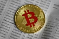 FILE PHOTO: The photo shows a physical imitation of a Bitcoin in Dortmund, western Germany. (Photo by INA FASSBENDER / AFP)