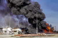 FILE PHOTO: A handout picture released by the official telegram channel of Syria's General Organization of Radio and Television on 23 November 2022 shows a fire raging at an unspecified hydrocarbon facility reportedly following a Turkish air strike in the vicinity of Tal Awdah in northeastern Syria's Hasakah province. (Photo by AFP)