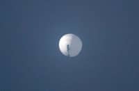 FILE PHOTO: This handout photo from Chase Doak taken on 1 February 2023 shows a suspected Chinese spy balloon in the sky. (Photo by Chase DOAK / CHASE DOAK / AFP)
