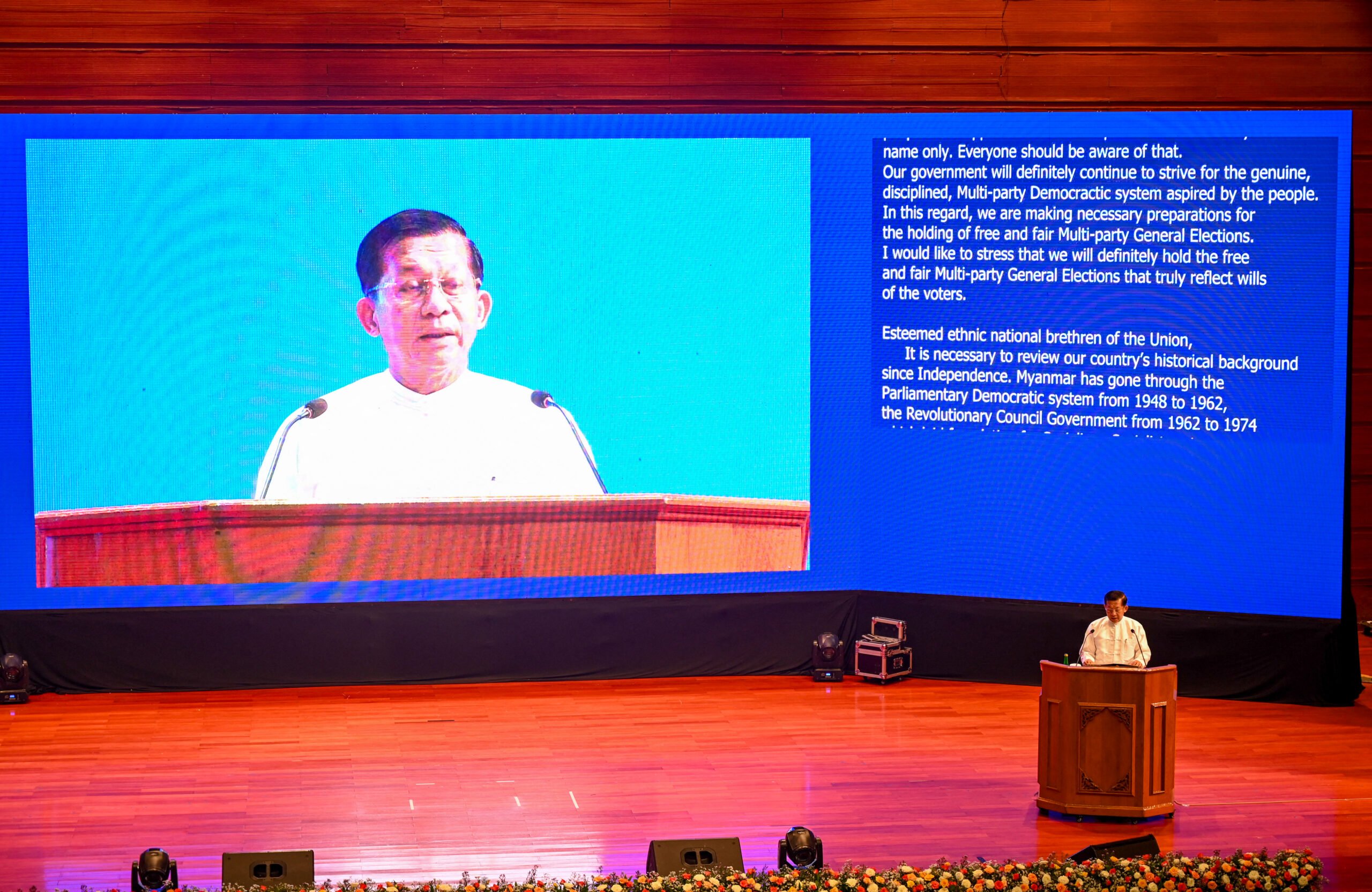 Myanmar's junta chief Min Aung Hlaing delivers a speech during a ceremony to mark the 8th anniversary of the Nationwide Ceasefire Agreement (NCA) in Naypyidaw on October 15, 2023. (Photo by AFP)