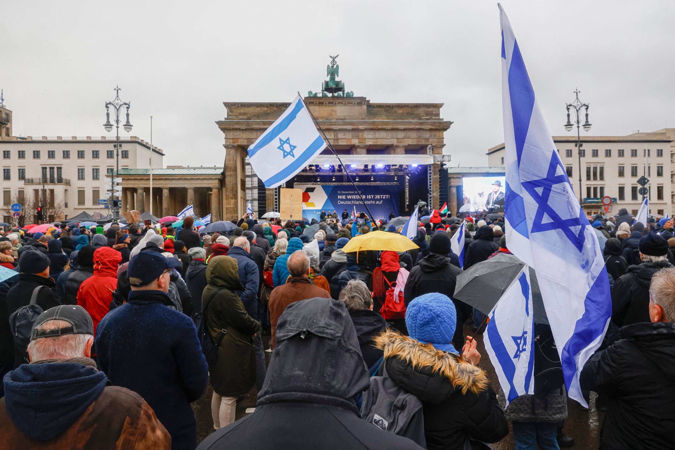 People take part in a demonstration against anti-Semitism on 10 December 2023 at Brandenburger Gate in Berlin. (Photo by MICHELE TANTUSSI / AFP)