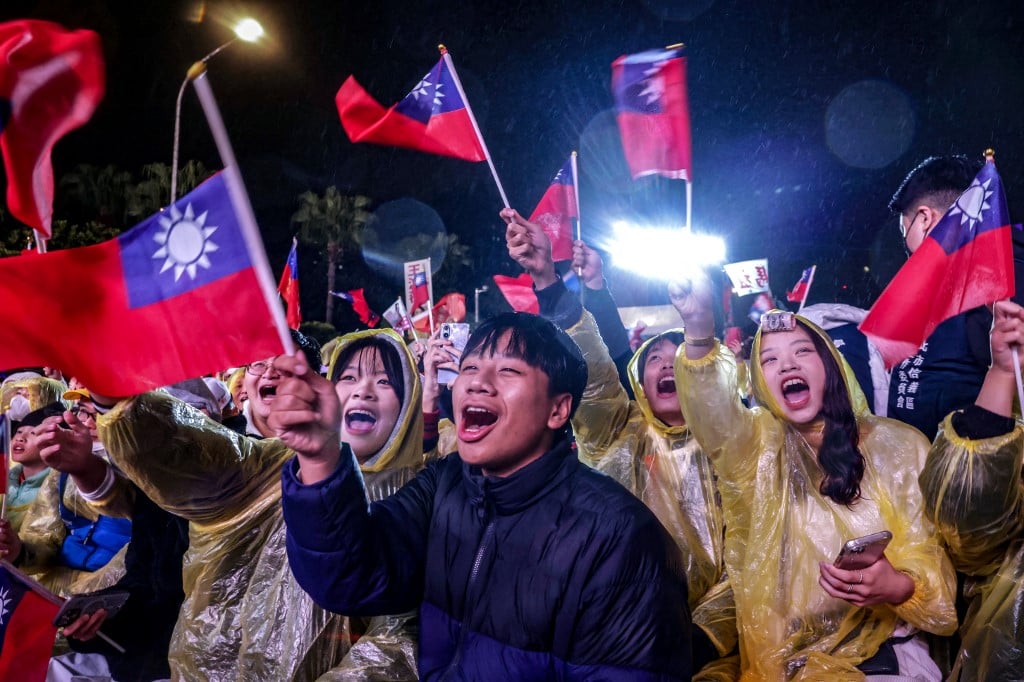 Supporters attend a Kuomintang (KMT) campaign rally ahead of Taiwan's presidential election in Taipei on December 23, 2023. (Photo by I-Hwa CHENG / AFP)