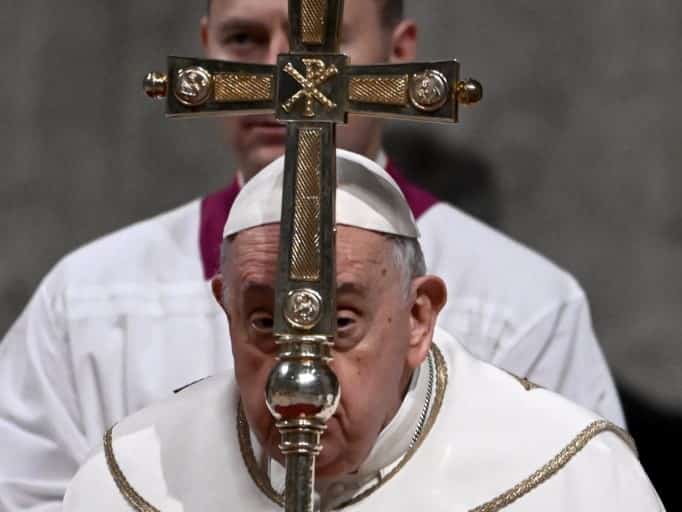 Pope Francis presides the Christmas Eve mass at St. Peter's Basilica in the Vatican on 24 December 2023. (Photo by Tiziana FABI / AFP)