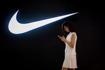Nike shares tumble as it cuts costs amid ‘softer’ outlook