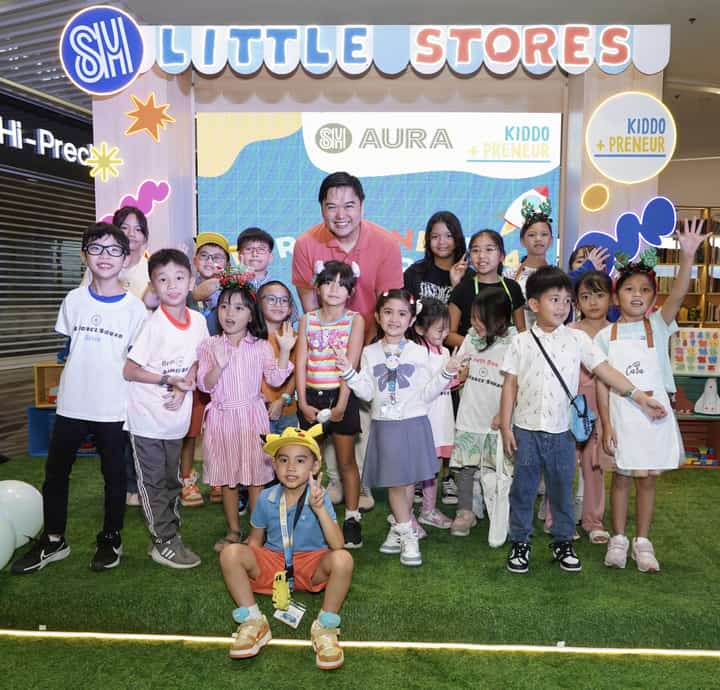 SM Engineering Design and Development President Hans "Chico" Sy Jr. (center) stands proudly alongside the young business owners.