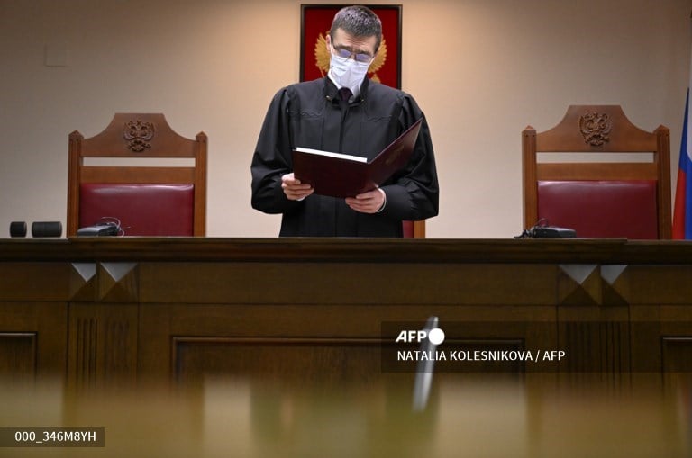 Oleg Nefedov, a judge of Russia's Supreme Court, reads a decision on a ministry of justice's request to brand the "international LGBT movement" an extremist organisation and ban its activity, in Moscow on November 30, 2023. Russia's top court on November 30, 2023 ruled to ban "international LGBT movement" for "extremism" without specifying whether individuals or organisations in Russia were being targeted. (Photo by NATALIA KOLESNIKOVA / AFP)