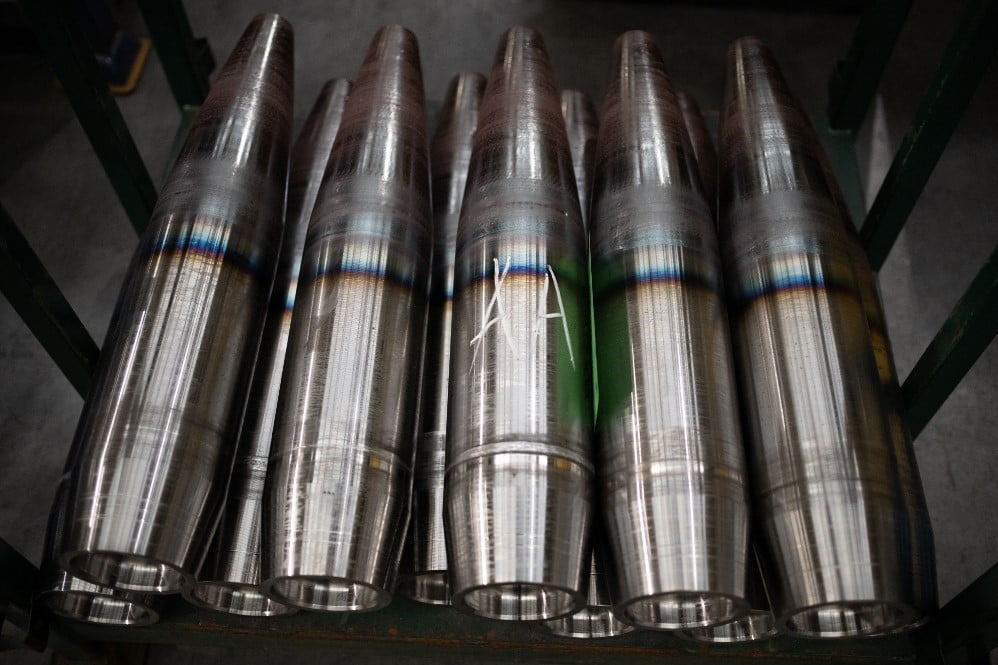 FILE PHOTO: Partially-finished 155mm artillery shell casings are seen during their manufacturing process at the BAE Systems factory in Washington, on 8 November 2023. (Photo by Oli SCARFF / AFP)