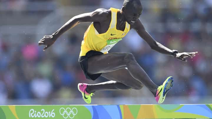 (FILES) Uganda's Benjamin Kiplagat competes in the Men's 3000m Steeplechase Round 1 during the athletics event at the Rio 2016 Olympic Games at the Olympic Stadium in Rio de Janeiro on August 15, 2016. Ugandan athlete Benjamin Kiplagat has been found dead in Kenya, police said on December 31, 2023, with local media reports saying he had been murdered. (Photo by Fabrice COFFRINI / AFP)