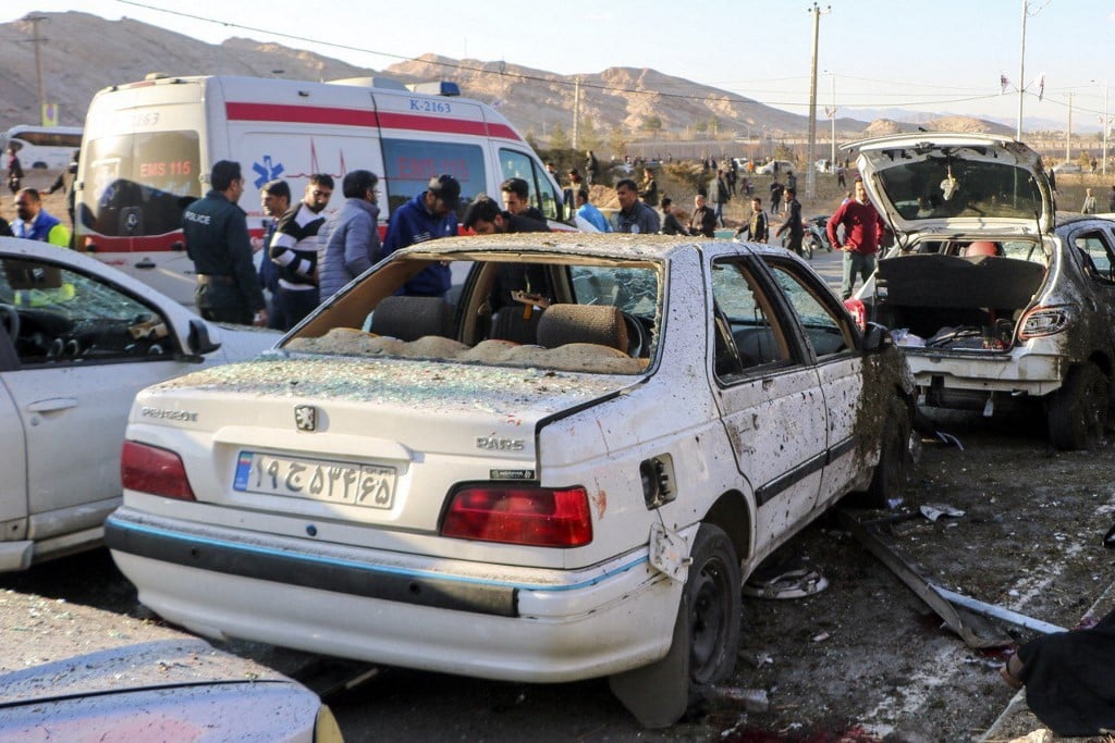 This photograph taken on January 3, 2024 shows destroyed cars and emergency services near the site where two explosions in quick succession struck a crowd marking the anniversary of the 2020 killing of Guards general Qasem Soleimani, near the Saheb al-Zaman Mosque in the southern Iranian city of Kerman. Photo by TASNIM NEWS / AFP
