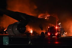 Japan Airlines plane on fire on runway at Tokyo’s Haneda airport