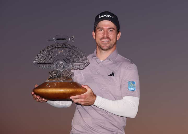Nick Taylor proudly holds the trophy after topping the Phoenix Open. | CHRISTIAN PETERSEN/AGENCE FRANCE-PRESSE