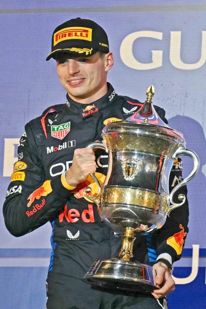 FIRST-PLACED Red Bull Racing's Dutch driver Max Verstappen holds the trophy during the podium ceremony of the Bahrain Formula One Grand Prix at the Bahrain International Circuit in Sakhir on Saturday. | ANDREJ ISAKOVIC/Agence France-Presse