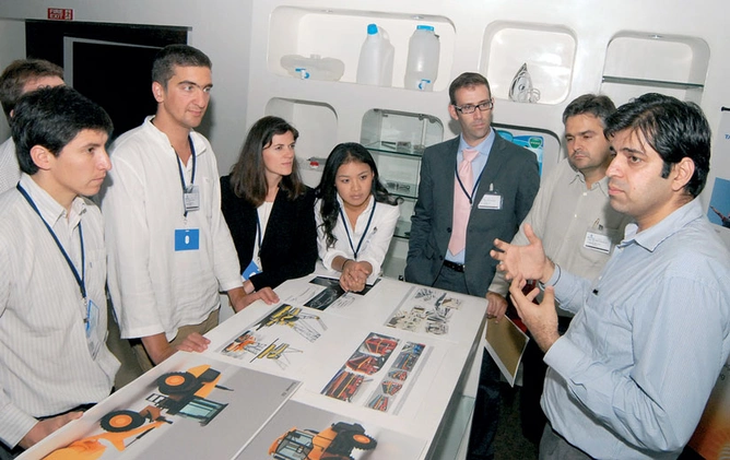 SHAPE OF THINGS TO COME: Tata Elxsi team members discuss an idea (top); a showcase of Tata Elxsi’s work.