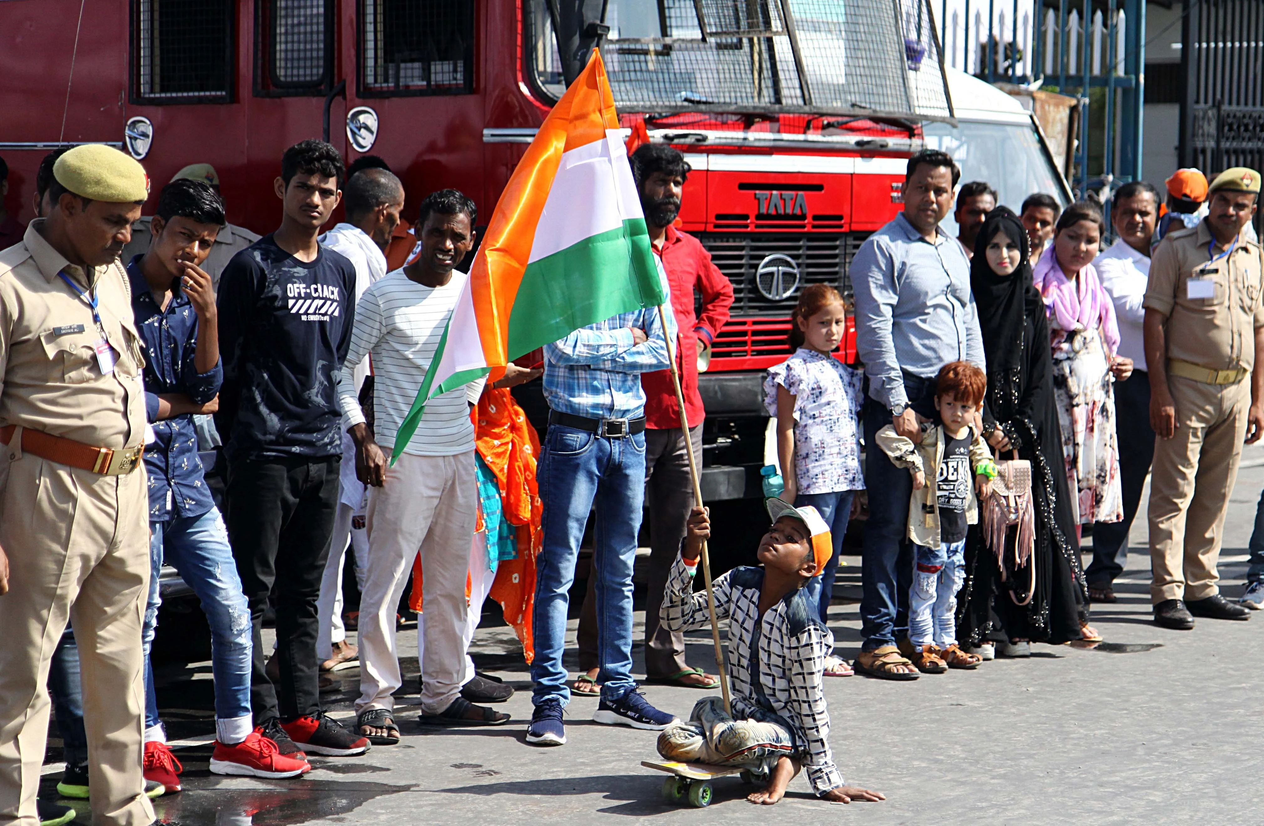 A disabled boy holding tricolor and moving on wheeled to express his joy in front of Vidhan Bhawan during Independence Day celebration in Lucknow