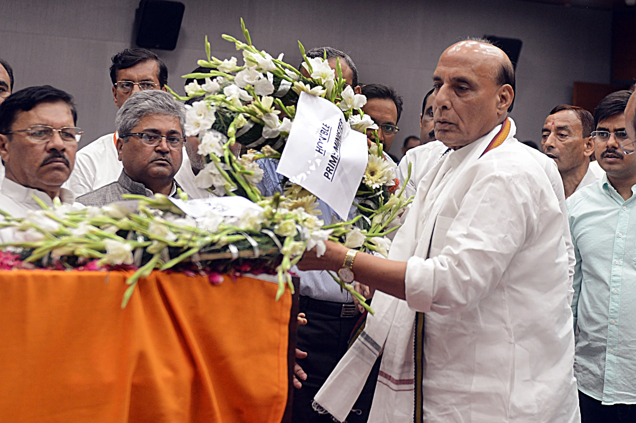Defence Minister Rajnath pays floral tributes on the behalf of Prime Minister Narendra Modi during the last respects of former Finance Minister Arun Jaitley at BJP headquarters in New Delhi