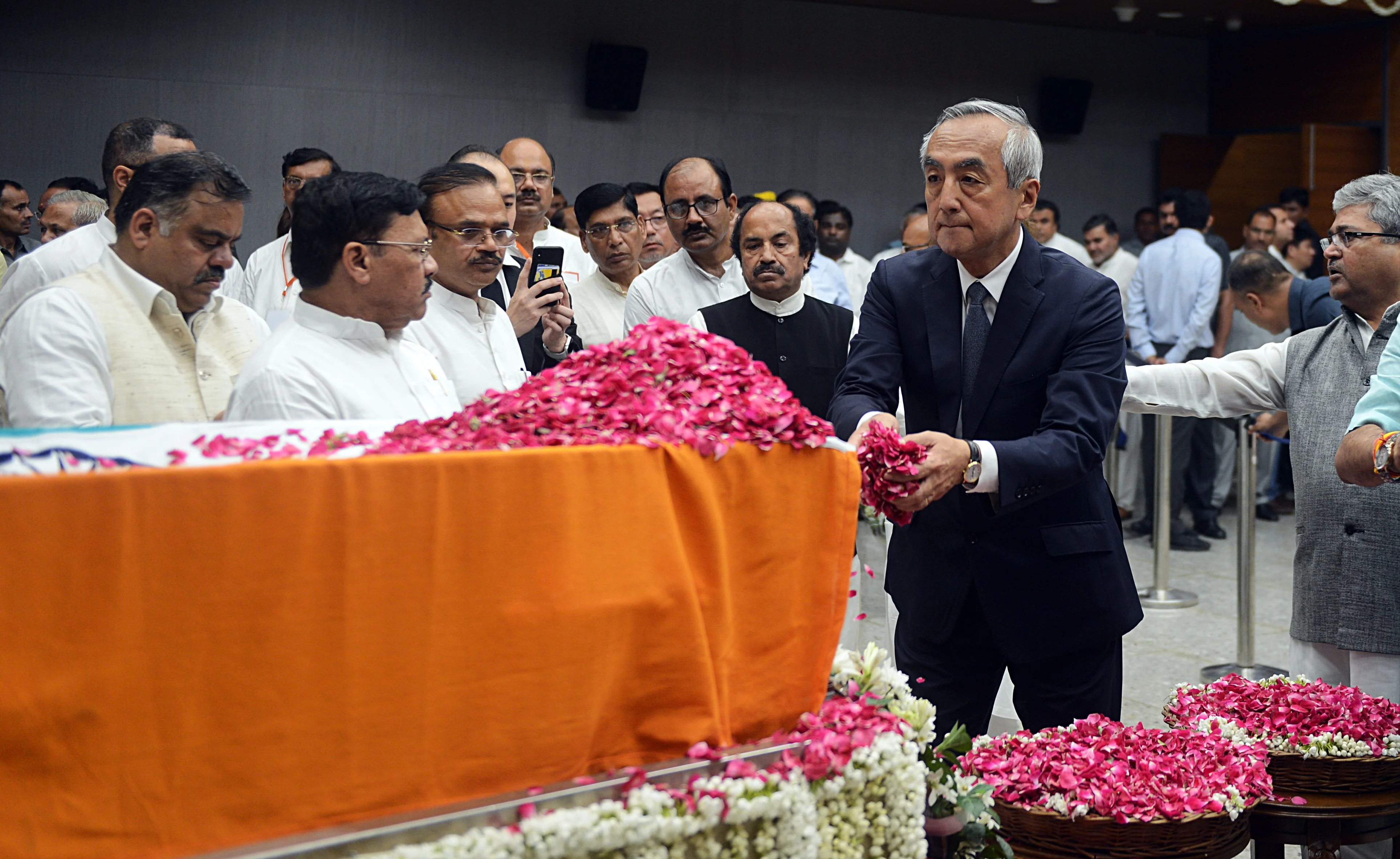 Japanese Embassy staff pays floral tributes during the last respects of former Finance Minister Arun Jaitley at BJP headquarters in New Delhi