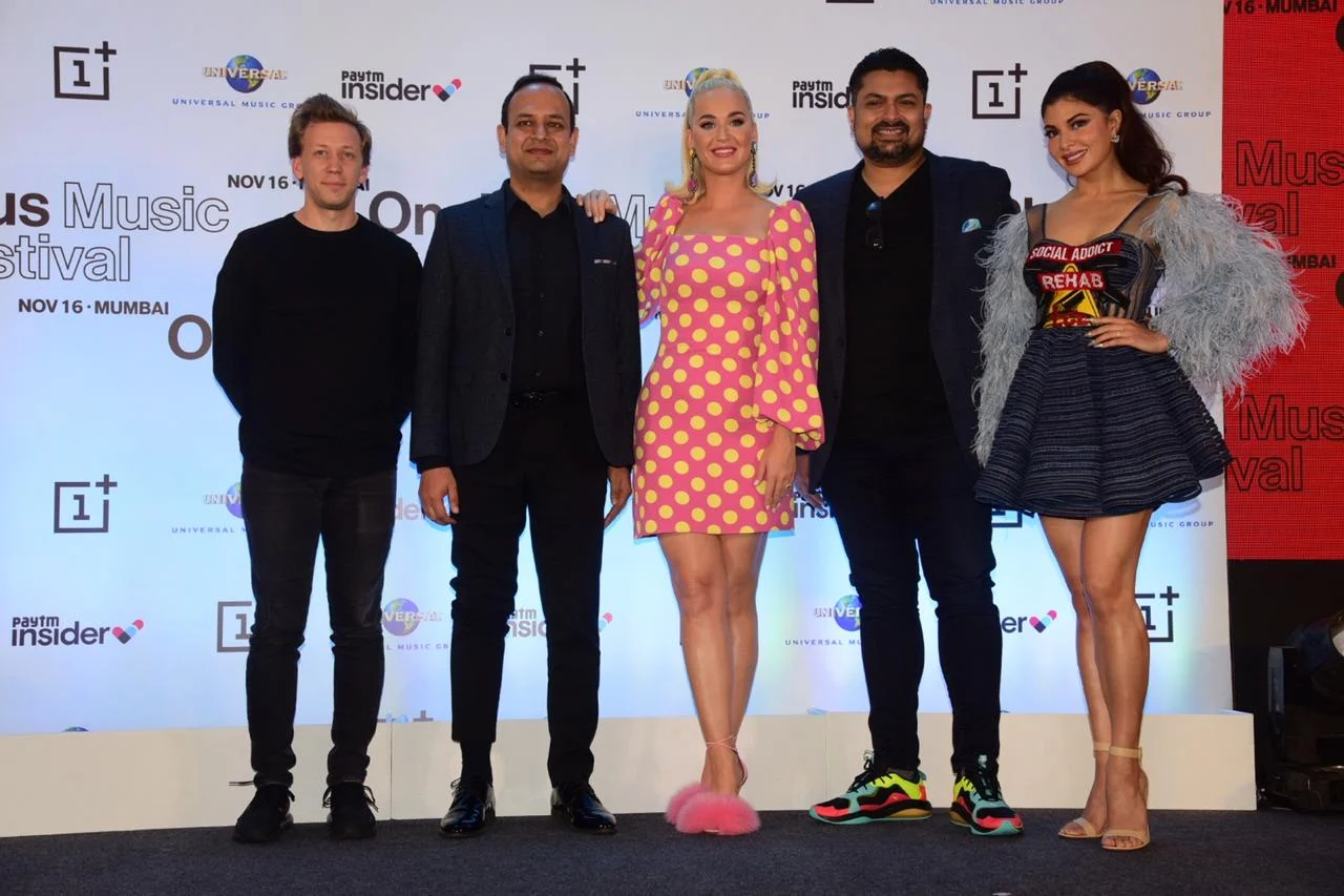 Katy Perry at press conference in Mumbai with organizers and Bollywood actress Jacqueline Fernandez.