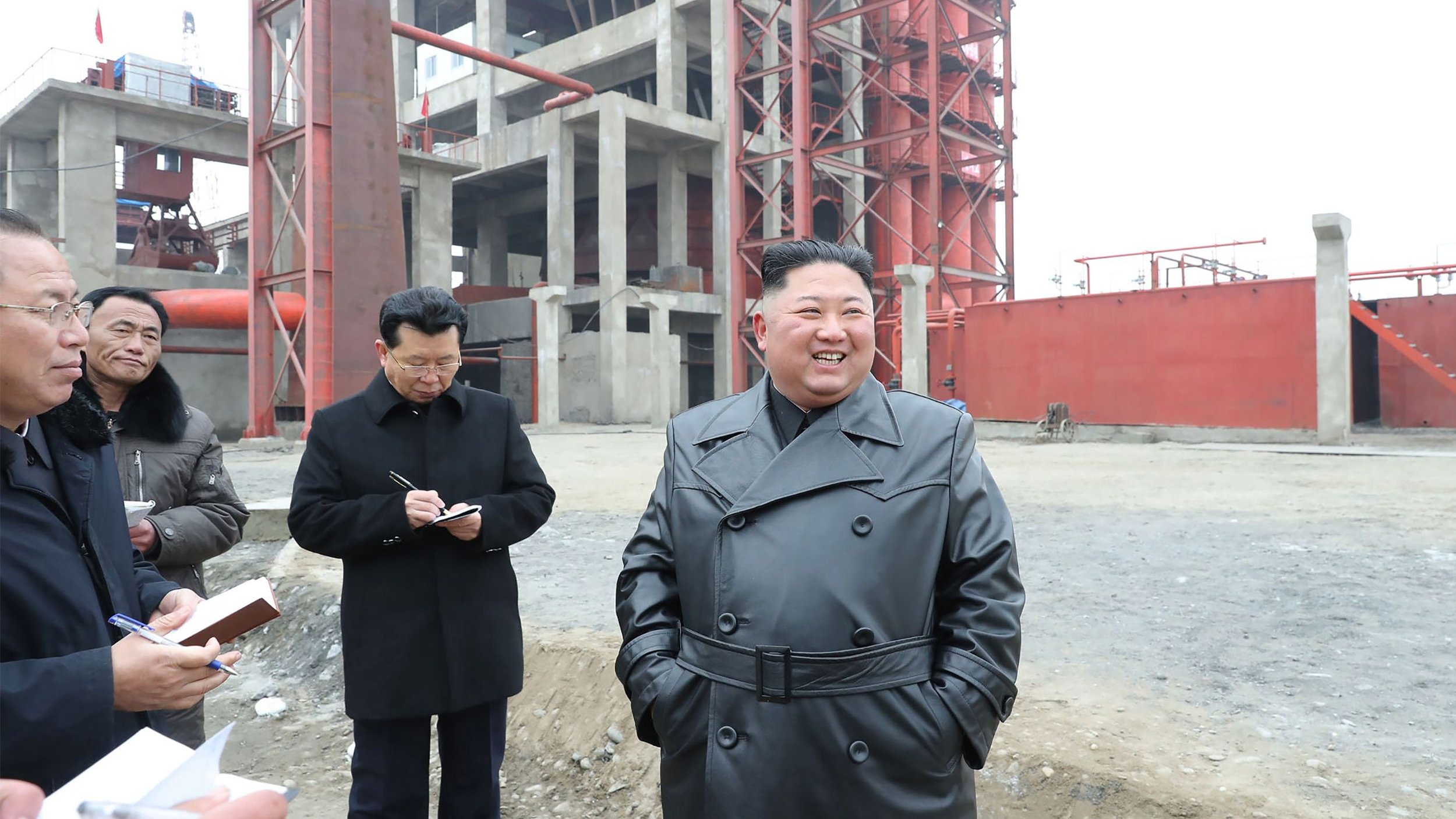 This undated picture released from North Korea's official Korean Central News Agency (KCNA) shows North Korean leader Kim Jong Un (R) visiting the construction site of the Sunchon phosphatic fertiliser factory in South Pyongan province. 