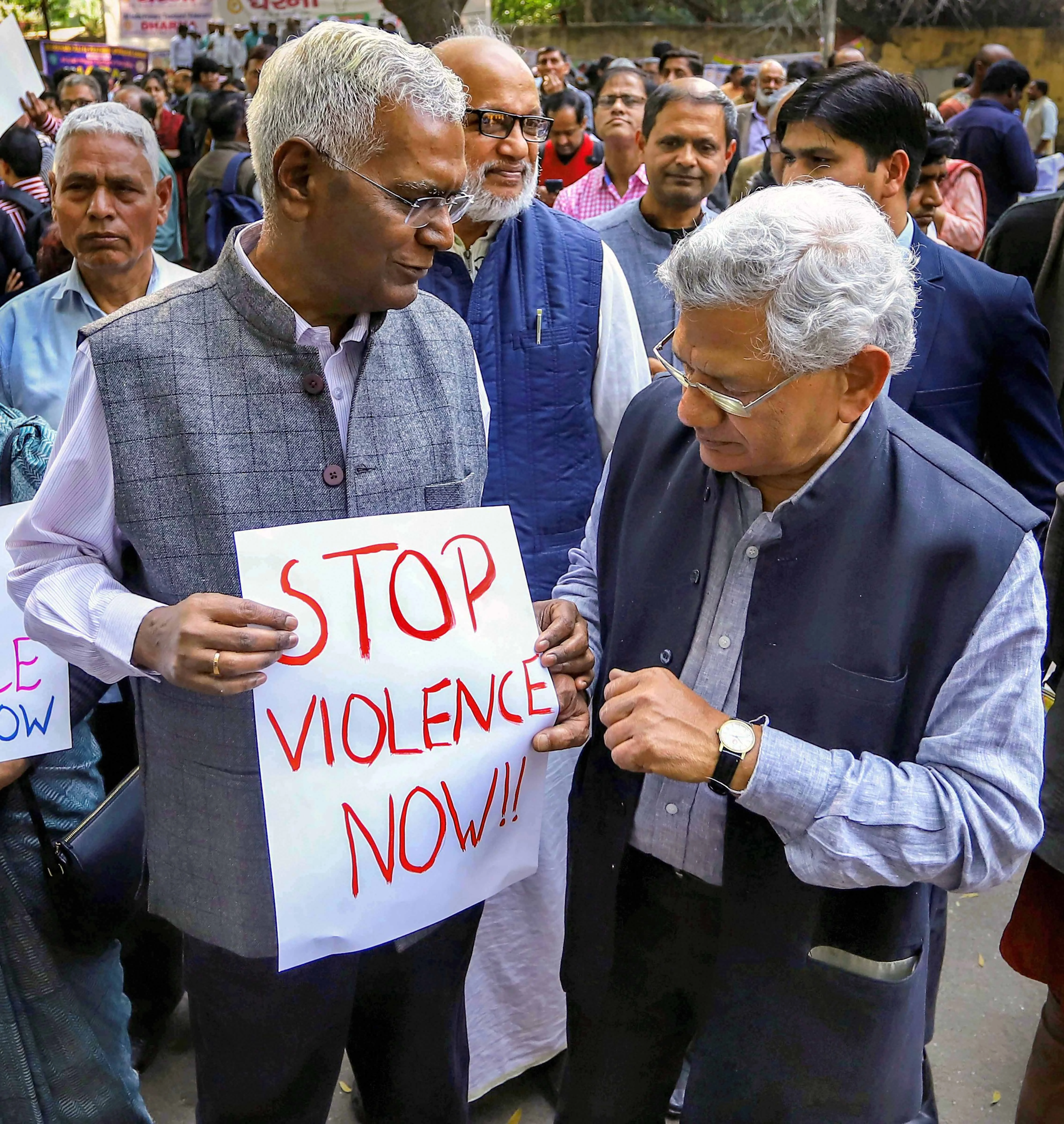 General Secretary of Communist Party of India (CPI) D Raja and CPI(M) general secretary Sitaram Yechury stage a peaceful protest in view of the recent violence in riot-affected areas of east delhi, in New Delhi, Wednesday, Feb. 26, 2020.