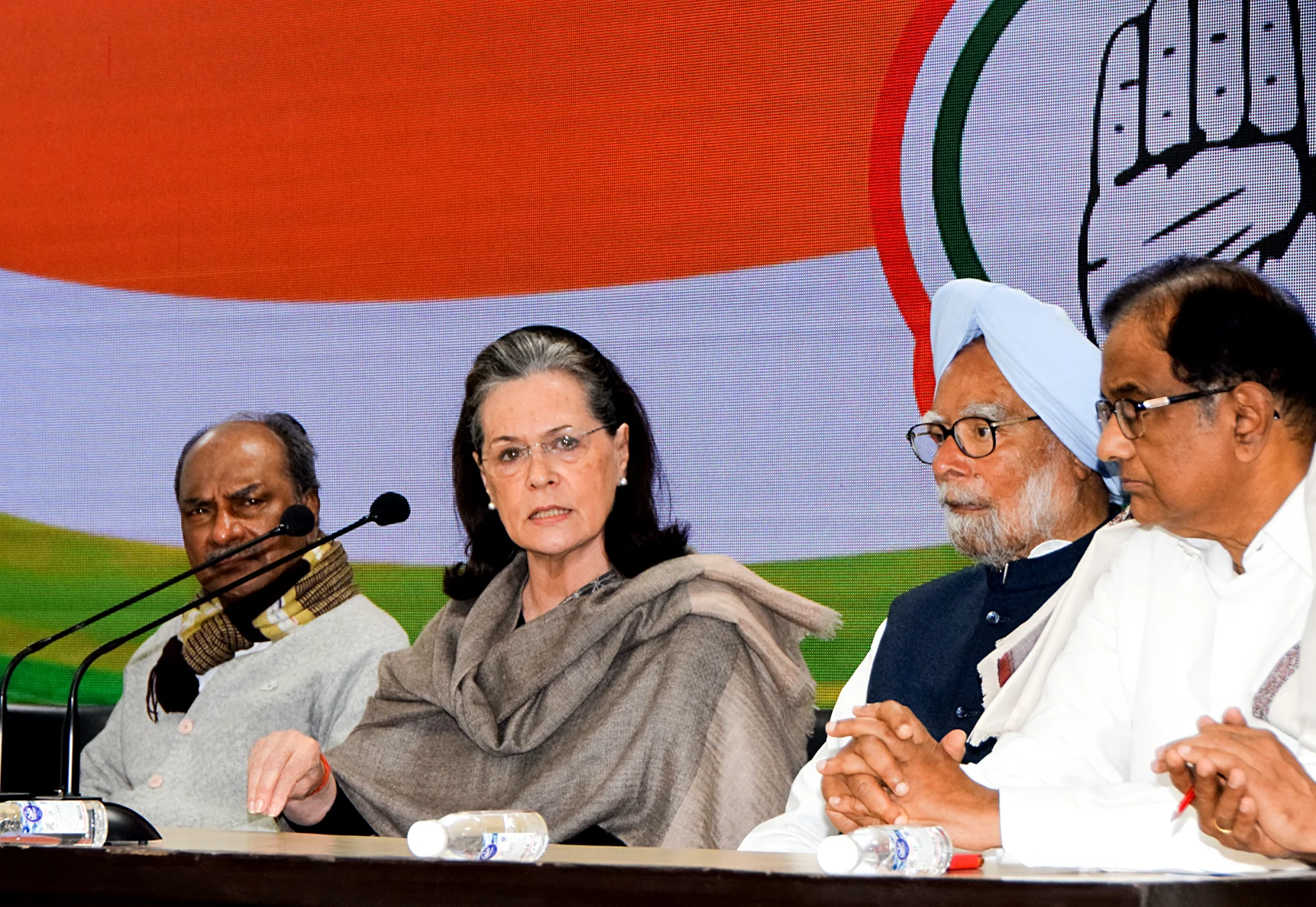 Congress Interim President Sonia Gandhi addresses a press conference along with former Prime Minister Dr. Manmohan Singh, and Former Defence Minister AK Antony in New Delhi on Wednesday.